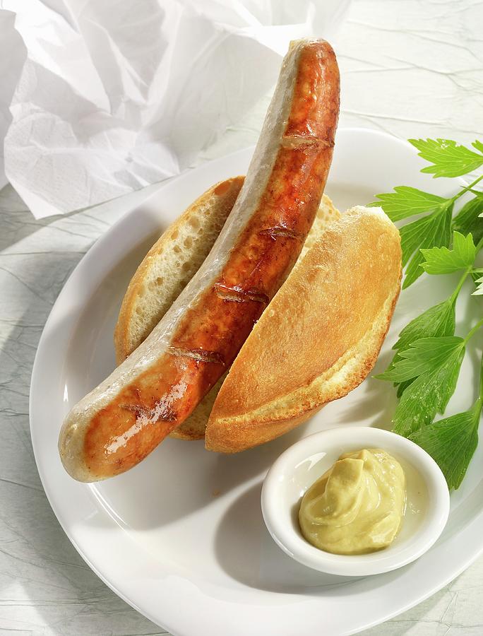 A Thuringian Sausage In A Roll With Mustard Photograph by Foodfoto Kln