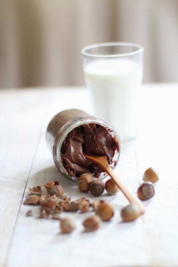 A Tipped Over Jar Of Chocolate Cream Photograph by Sylvia E.k Photography