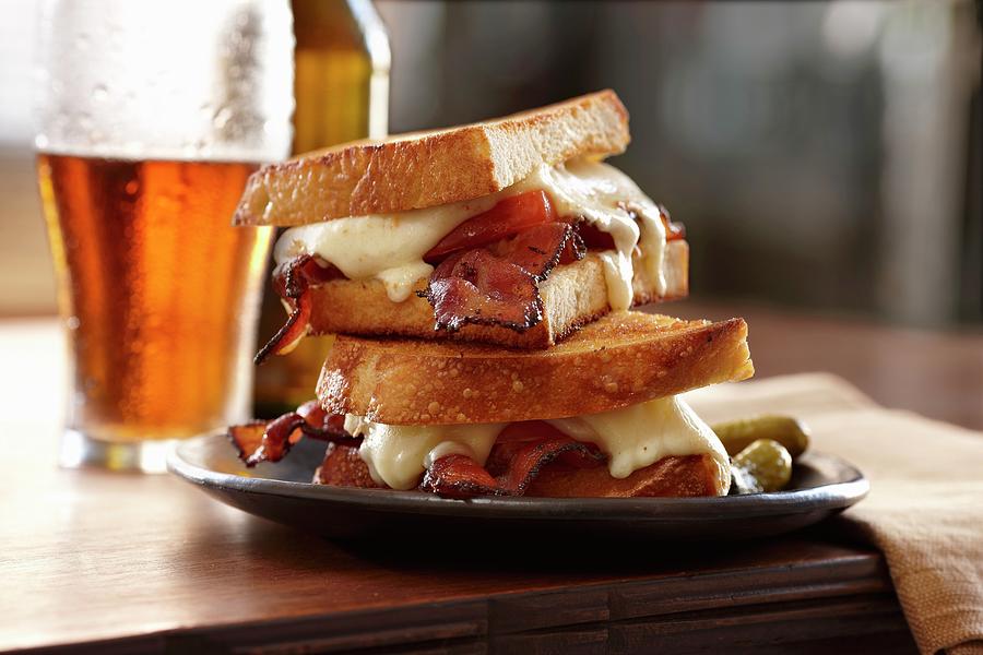 A Toasted Bacon And Cheese Sandwich With Beer Photograph by Michael