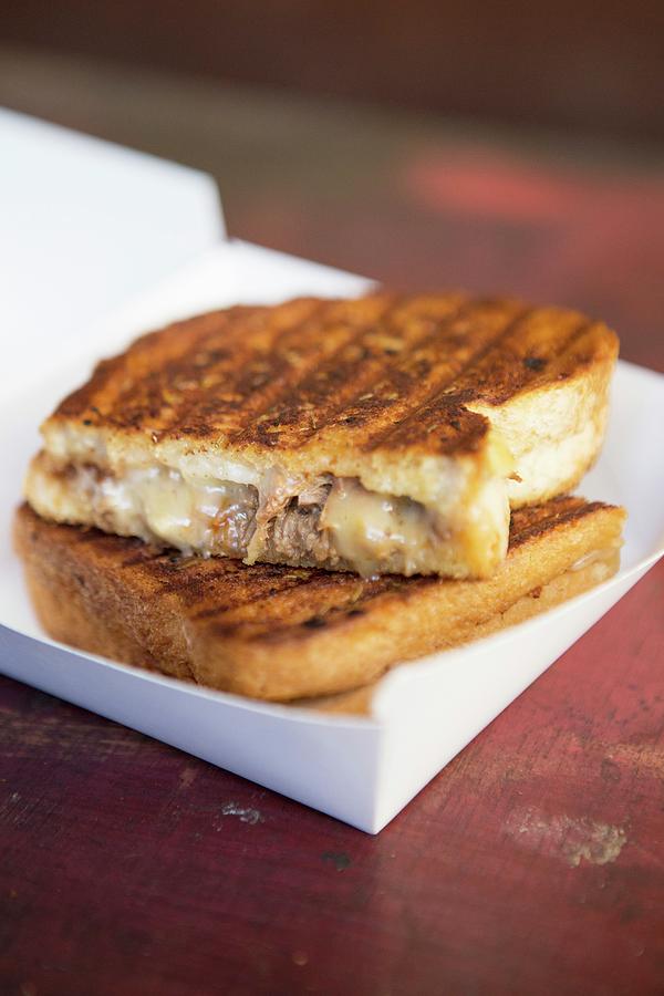 A Toasted Sandwich With Meat And Cheese Photograph by Daniela Haug