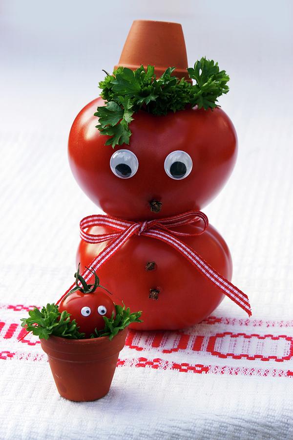 A Tomato Man With A Face And A Tomato Baby In A Flowerpot Photograph by Angelica Linnhoff