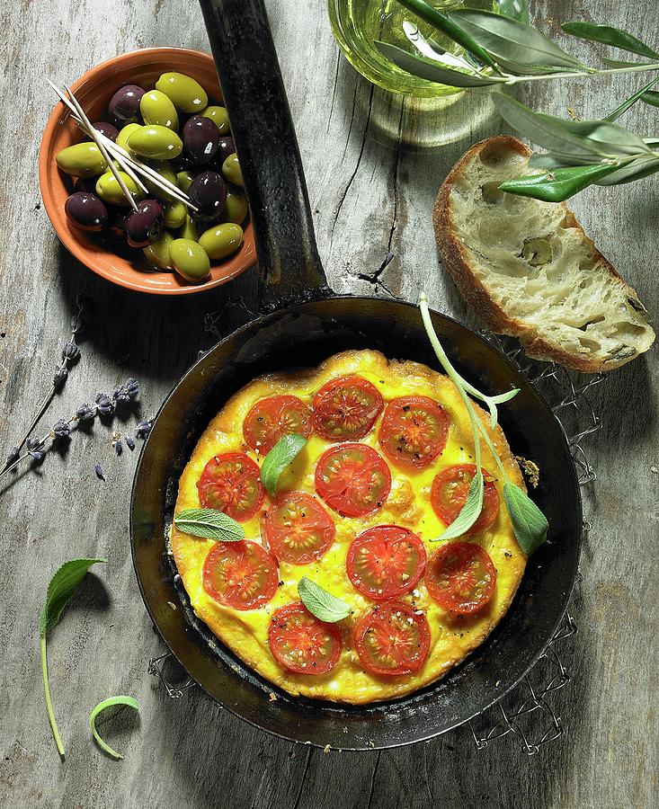 A Tomato Omelette With Sage, Black And Green Olives, Olive Oil, An Olive Spring, Olive Ciabatta And Lavender Photograph by Brigitte Wegner