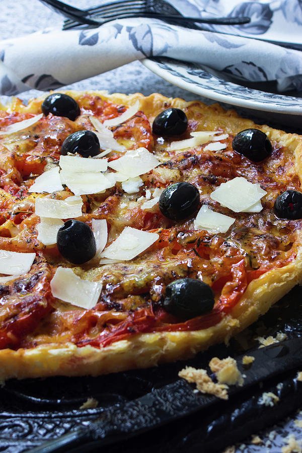 A Tomato Tart With Shaved Parmesan And Olives Photograph by Charlotte Von Elm