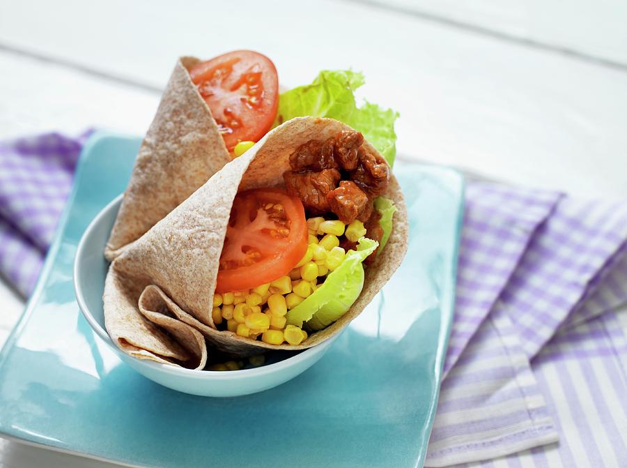 A Tortilla Wrap With Beef, Sweetcorn And Vegetables Photograph by Martin Dyrlv