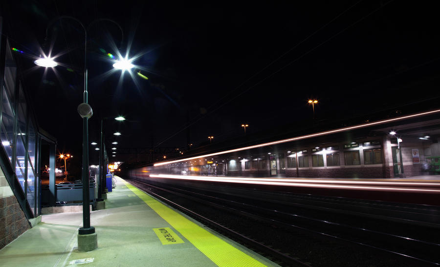 A Train Going Through A Station At Night Photograph by Elisabeth Pollaert Smith