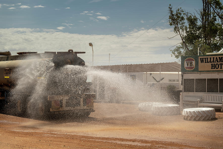 A Tuck Waters Down The Road To Minimise Dust.?william Photograph by Doug Gimesy / Naturepl.com A Tuck Waters Down The Road To Minimise Dust.?william Photograph by Doug Gimesy / Naturepl.com