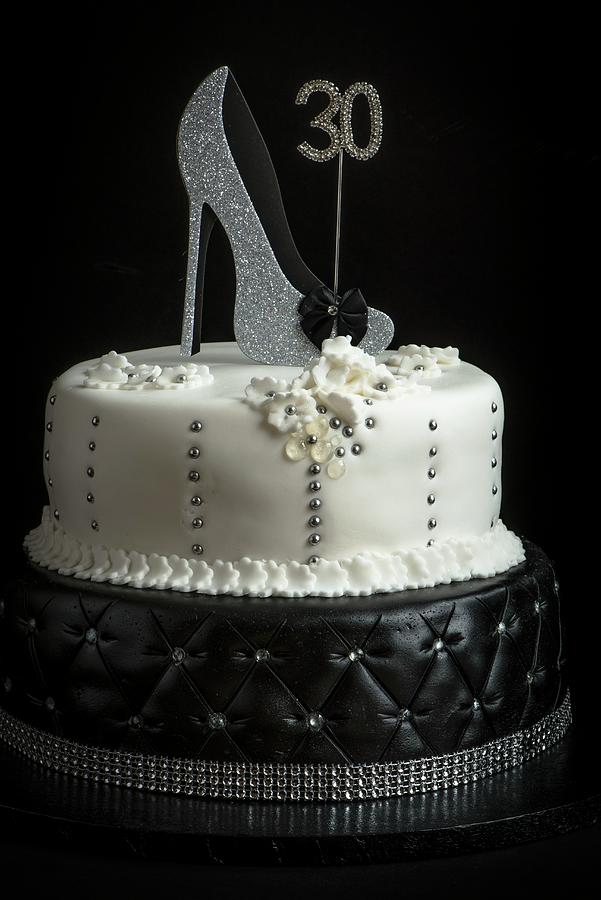 A Two Tier Birthday Cake In Black And White Decorated With A Shoe Photograph by Magdalena Hendey