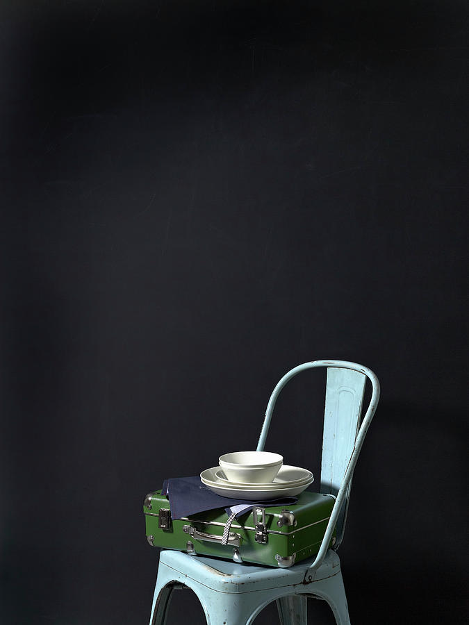 A Utensils Case, Tea Towels And White Crockery On A Chair Photograph by Luzia Ellert