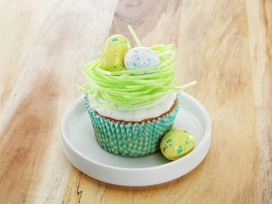 A Vanilla Cupcake With Easter Decorations Photograph by Albert P Macdonald