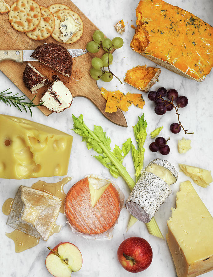 A Variety Of Cheeses With Fruits And Crackers On A Marble Background Photograph by Hugh Johnson