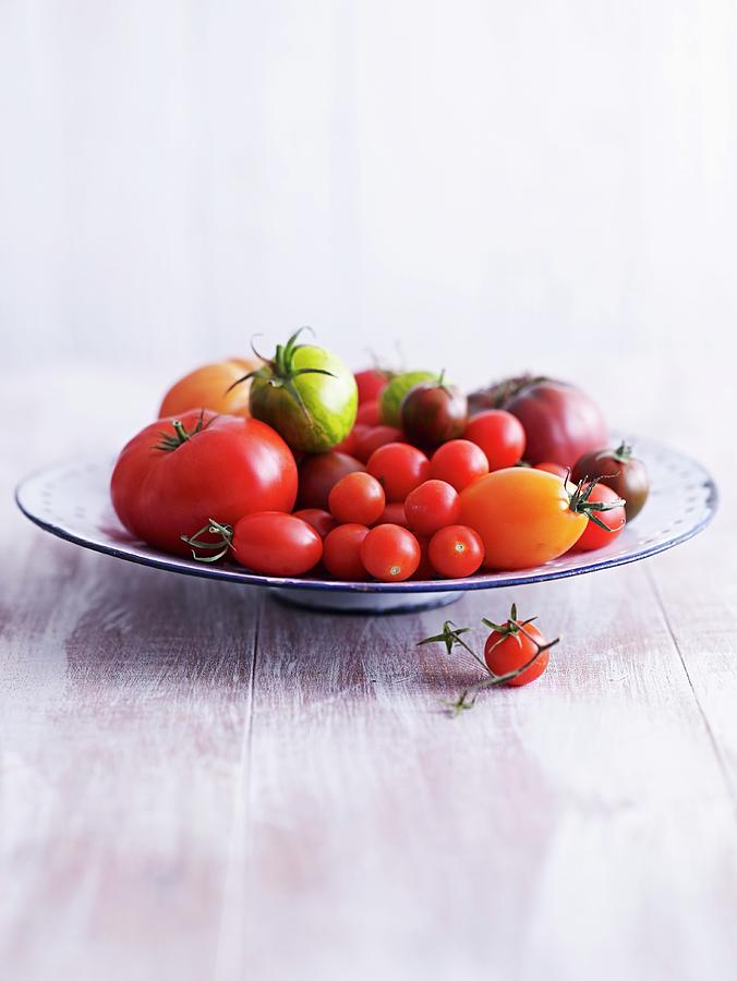 A Variety Of Tomatoes On A Plate Photograph by Brachat, Oliver