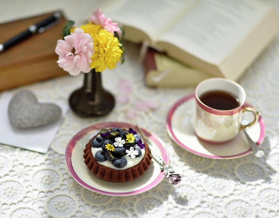 A Vegan Blueberry Tartlet For Tea, Flowers And Books In The Background Photograph by B.b.s Bakery