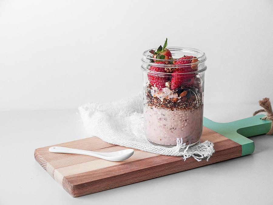 A Vegan Breakfast In A Glass With Yoghurt, Muesli And Strawberries Photograph by Freiknuspern
