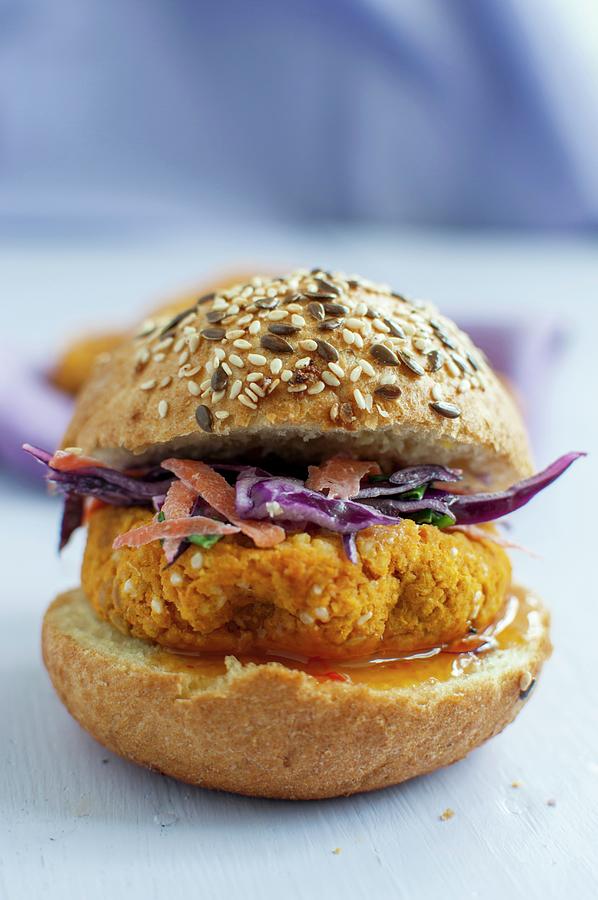A Vegan Burger Made From Chickpeas, Millet And Sweet Potatoes On A Wholemeal Roll With Red Cabbage Salad And Mango Sauce Photograph by Kachel Katarzyna