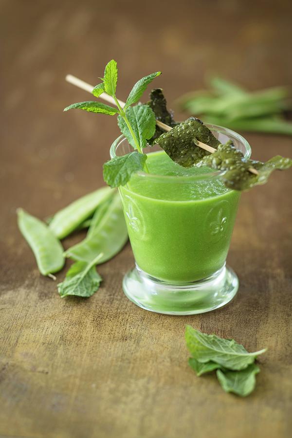 A Vegan Snow Pea Shot With Algae Bacon And Mint detox Photograph by Jan Wischnewski