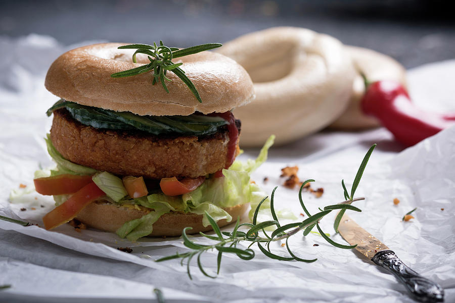 A Vegan Tofu And Bean Patty Served In A Bagel With Salad Photograph by Kati Neudert