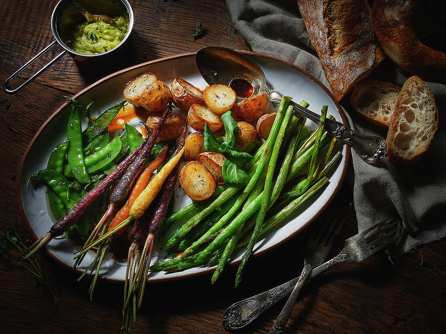 A Vegetable Platter With Potatoes, Asparagus, Carrots And Mange Tout Photograph by Vadim Piskarev