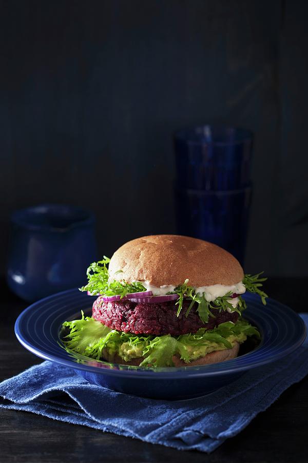A Veggie Burger With A Beetroot Patty, Avocado Spread And Vegan Sauce Photograph by Olga Miltsova