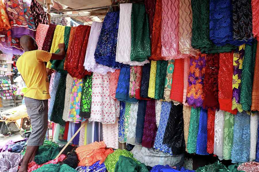 A Vendor Arranges Lace Materials Photograph by Temilade Adelaja - Fine ...