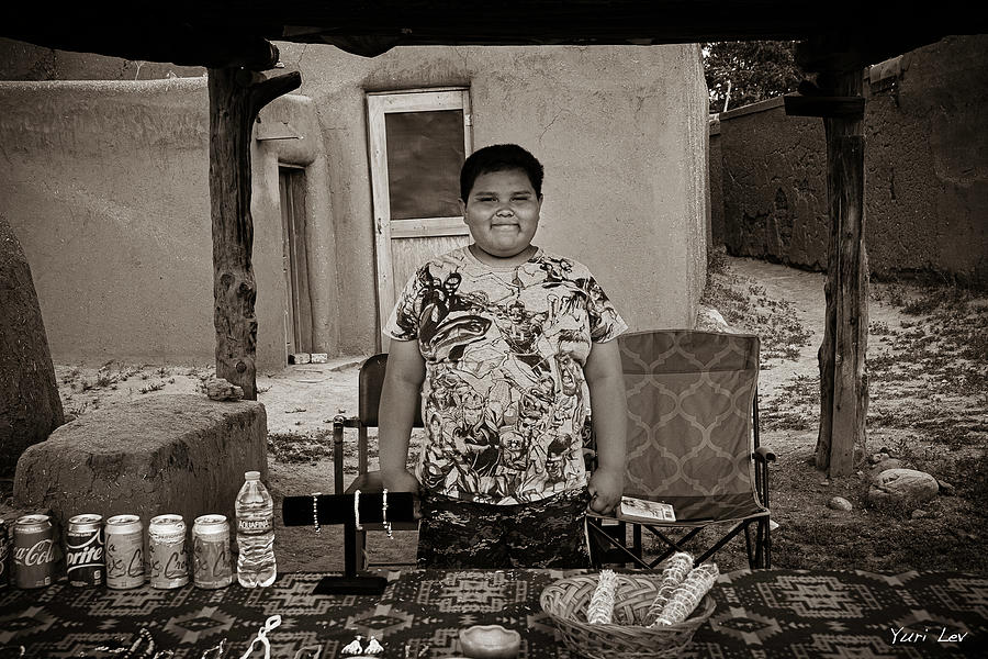 A Vendor at Taos Pueblo Photograph by Yuri Lev