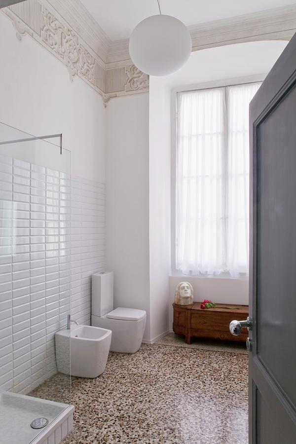 A View Into An Art Nouveau Bathroom With A Designer Bidet And A Toilet And A Terrazzo Floor Photograph by Fabio Lombrici