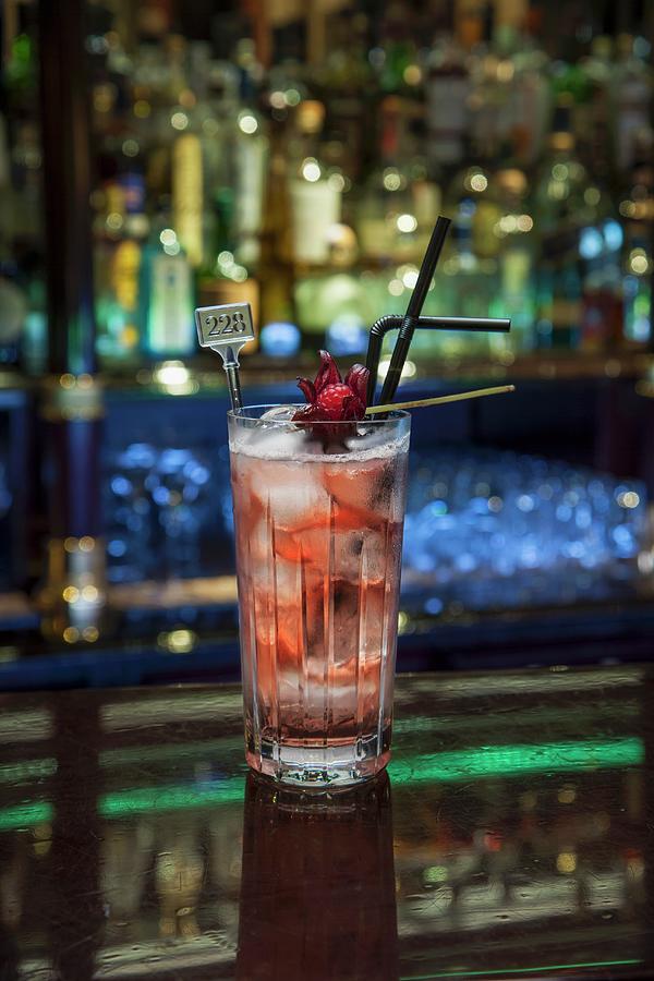 A Vodka And Tonic With Grenadine Photograph by Christophe Madamour