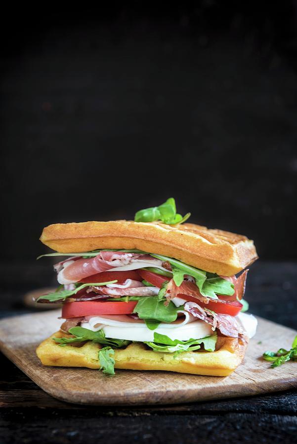 Bread Photograph - A Waffle Sandwich With Ham, Tomato, Mozzarella And Rocket by Ltummy