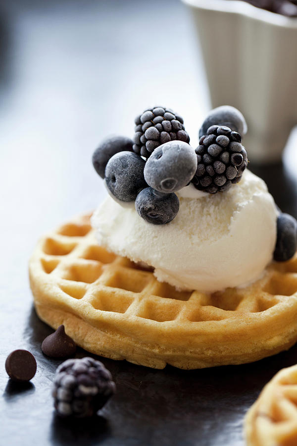 A Waffle Topped With Ice Cream And Frozen Blackberries Photograph by Ryla Campbell