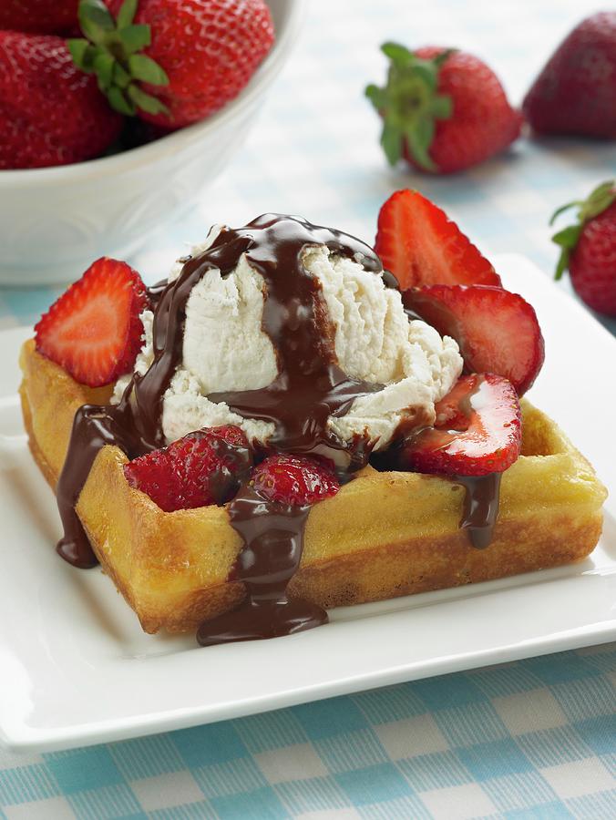 Fruit Photograph - A Waffle Topped With Strawberries, Vanilla Ice Cream And Chocolate Sauce by Michael S. Harrison