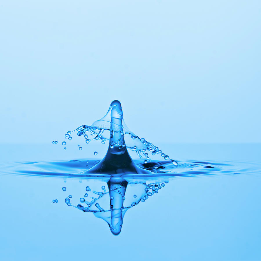 A Water Drop Collision And A Hat-like Photograph by Kim Westerskov