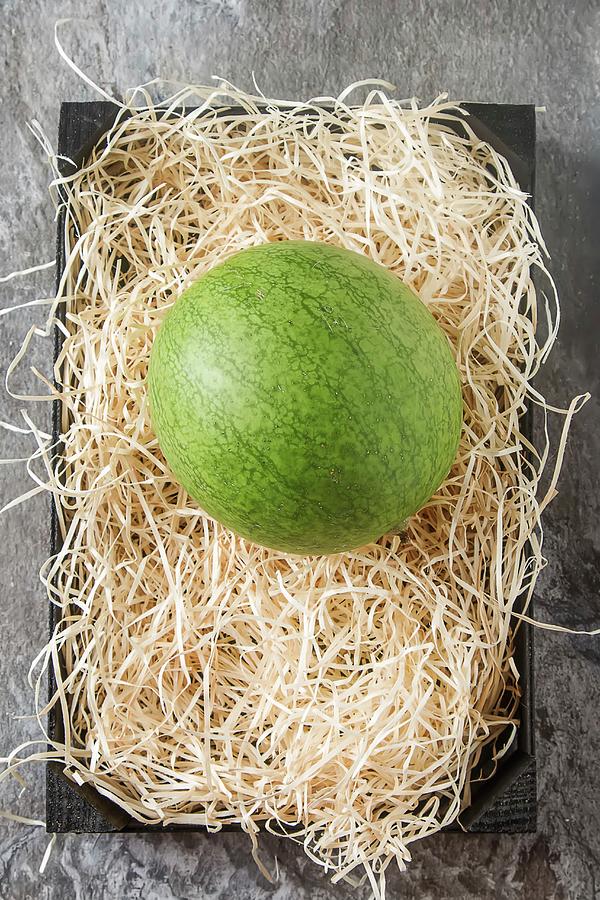 A Watermelon On A Bed Of Straw seen From Above Photograph by Naltik
