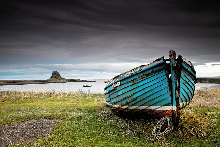 A Weathered Boat Sitting On The Shore Photograph by John Short / Design Pics