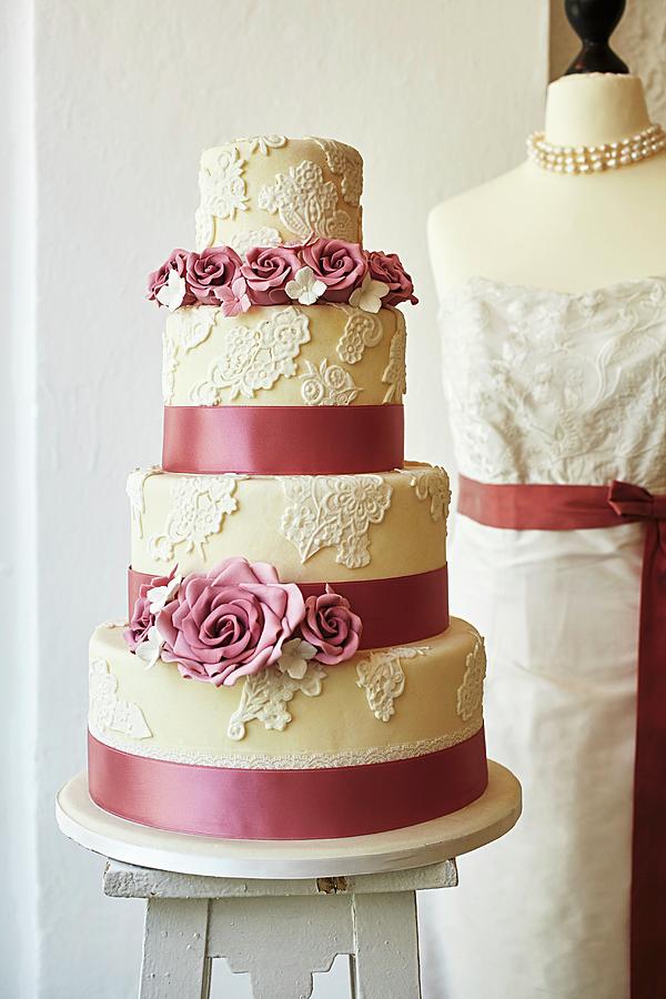 A Wedding Cake Decorated With Roses Photograph by Herbert Lehmann
