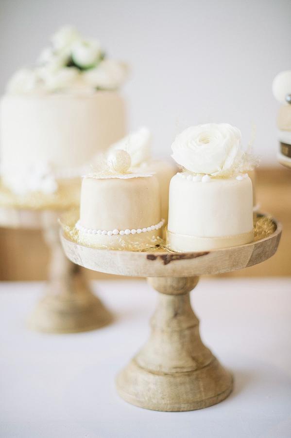 A Wedding Cake On A Restaurant Table Photograph by Clara Tuma