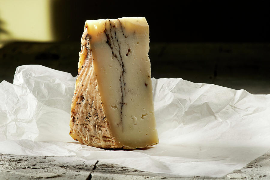 A Wedge Of Pecorino With Truffle On White Paper Photograph by Christoph Maria Hnting