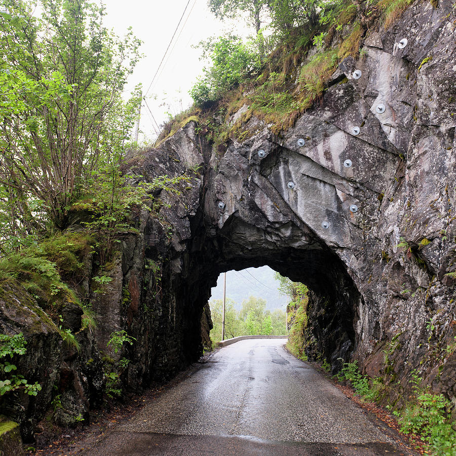 A Wet Road Leading Through A Tunnel In Photograph by Keith Levit / Design Pics