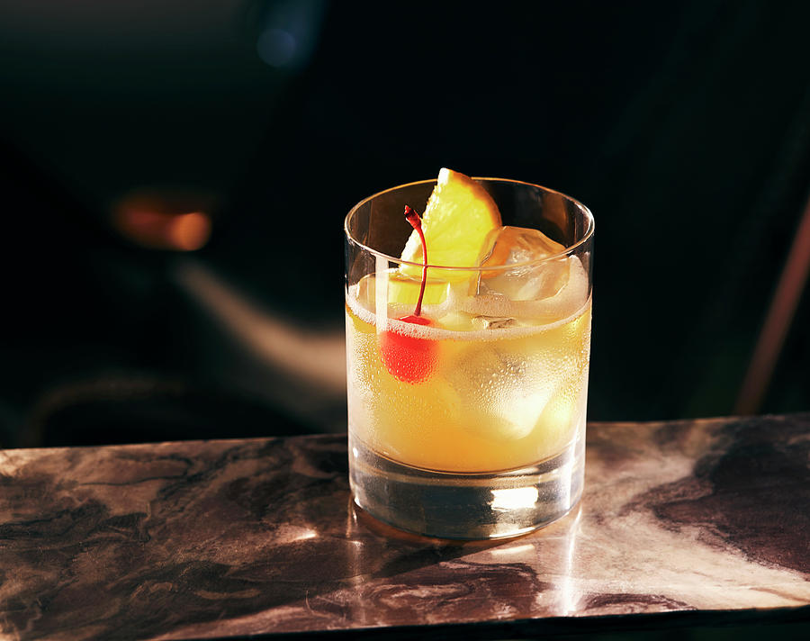 A Whiskey Sour Against A Dark Surface Photograph by Misha Vetter