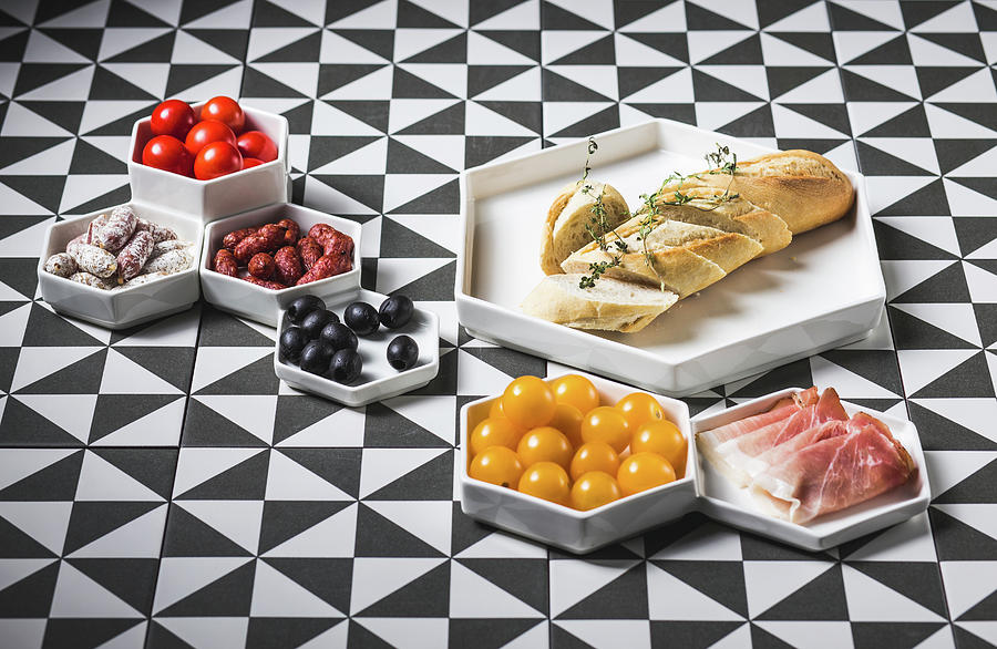 A White Baguette With Various Antipasti On A Patterned Surface Photograph by Karolina Kosowicz