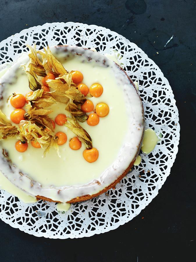 A White Chocolate Cake With Limoncello And Physalis Photograph by Lina Eriksson