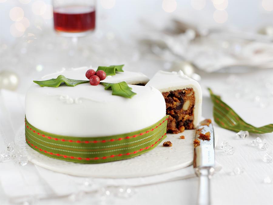 A White Christmas Cake With A Green Ribbon Photograph by Ian Garlick