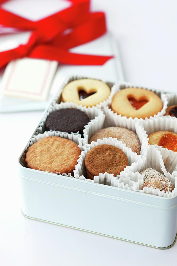 A White Gift Box With Various Cookies And Linz Sandwich Biscuits Photograph by Katharine Pollak