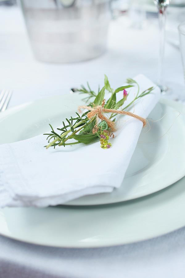 A White Napkin With A Delicate Bouquet Of Herbs Photograph by Great Stock!