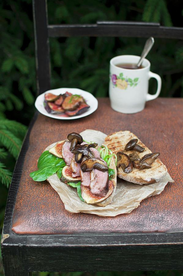 A Whole Grain Sandwich With Lambs Lettuce, Roasted Duck Breast And Wild Mushrooms Photograph by Kachel Katarzyna