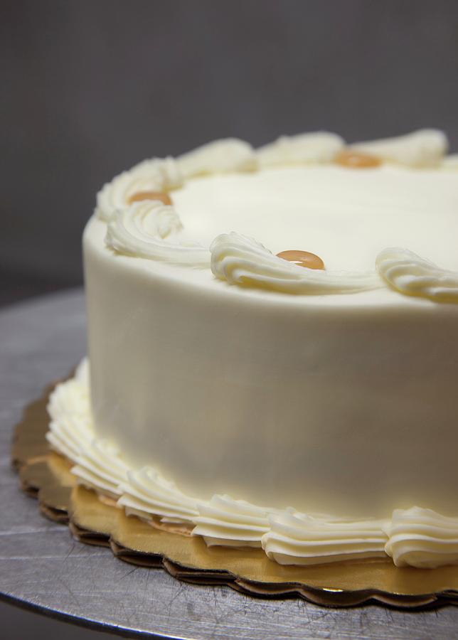 A Whole Layer Cake With Buttercream And Caramel Dots Photograph by Katharine Pollak