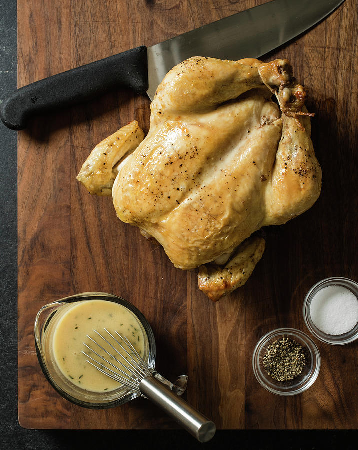 A Whole Roast Chicken With Gravy, Salt And Pepper Photograph by Snowflake Studios