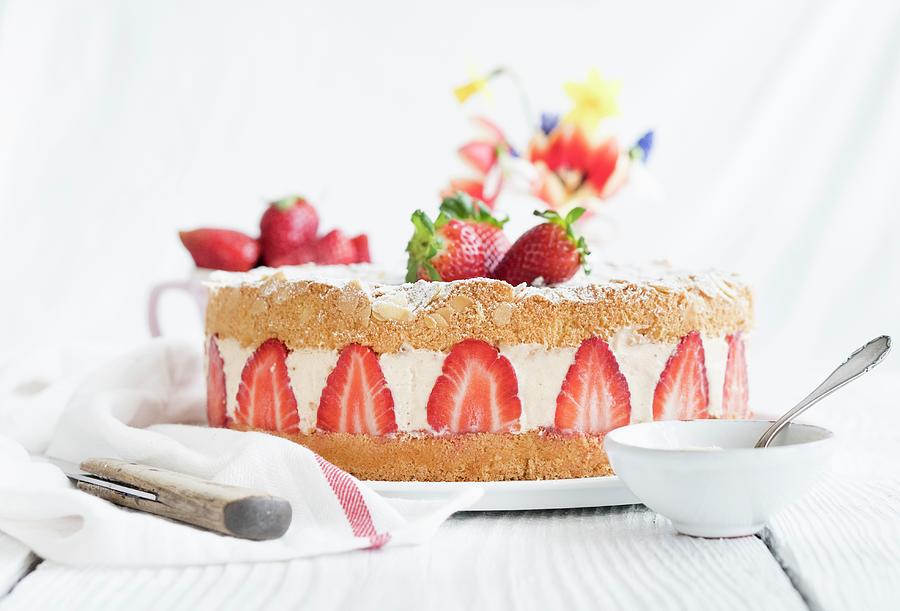 A Whole Strawberry Cream Cake On A Table Photograph by Tamara Staab