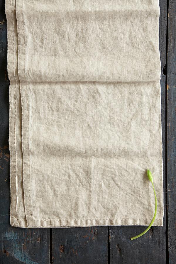 A Wild Garlic Flower On A Linen Cloth seen From Above Photograph by Anke Schtz