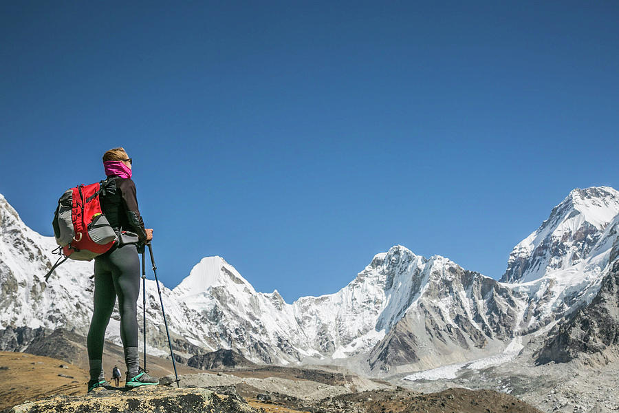 A Woman Contemplates A Cirque Of Peaks In The Everest Region Photograph ...