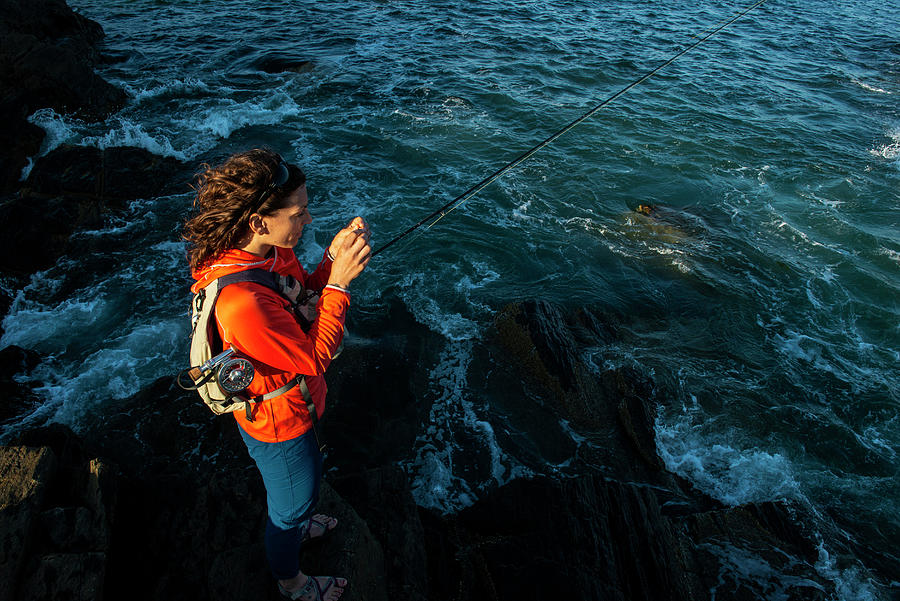 Portland Photograph - A Woman Fly Fishing On The Caost Of Maine. by Cavan Images