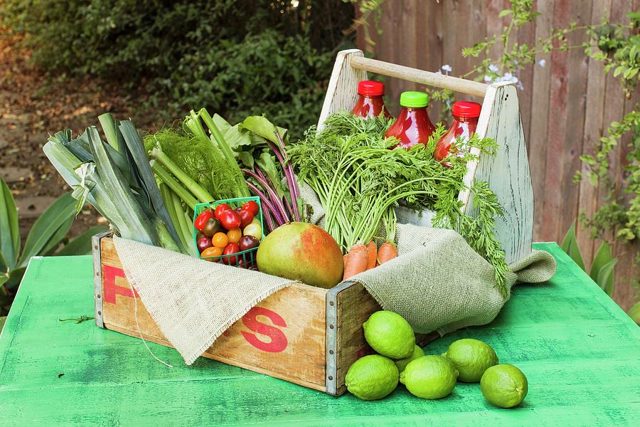 A Wooden Crate Of Fruit And Vegetables On A Rustic Garden Table Photograph by Don Crossland